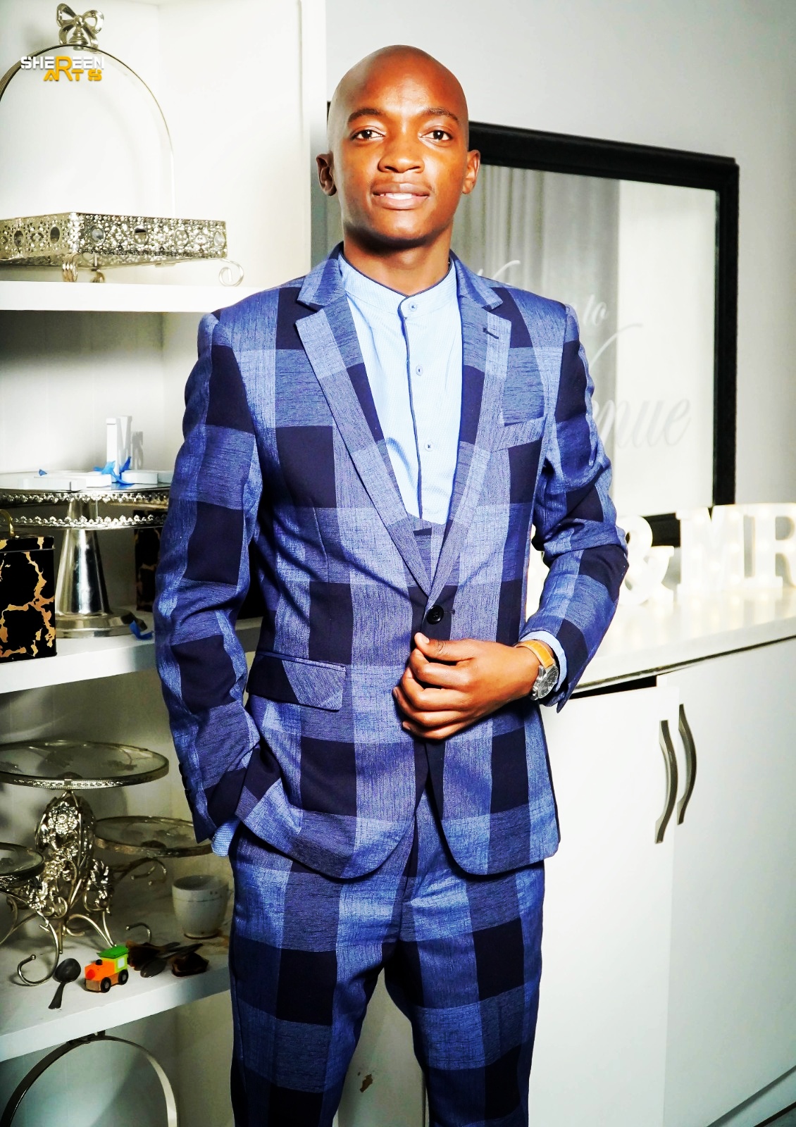 Keith Vilani in a blue checkered suit